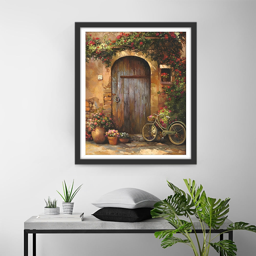 Fleurs et Vélo devant la Porte Broderie Diamant